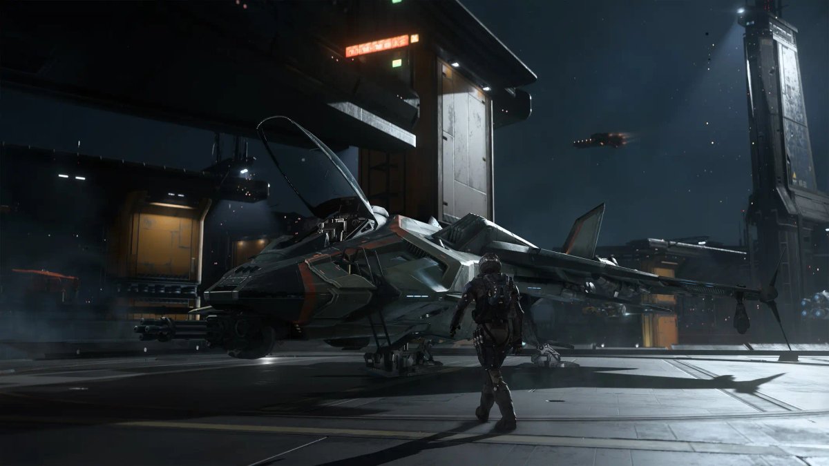 Isang piloto na nakatayo sa tabi ng isang makintab at kulay abong starfighter sa hangar deck ng isang futuristic na space station sa Squadron 42.